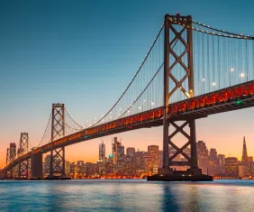 San Francisco skyline with Oakland Bay Bridge at sunset, California, USA