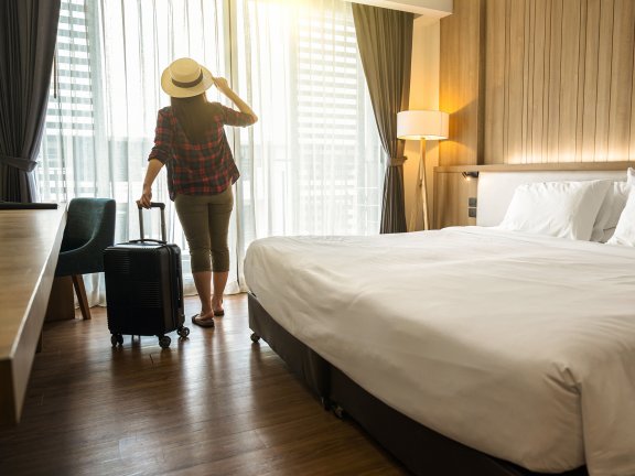 Traveler in Hotel Room